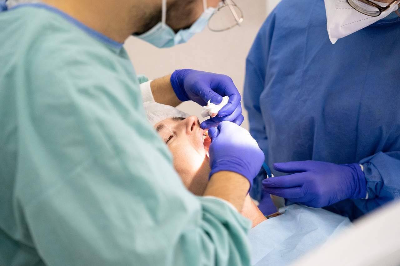 dentists working on a patients teeth