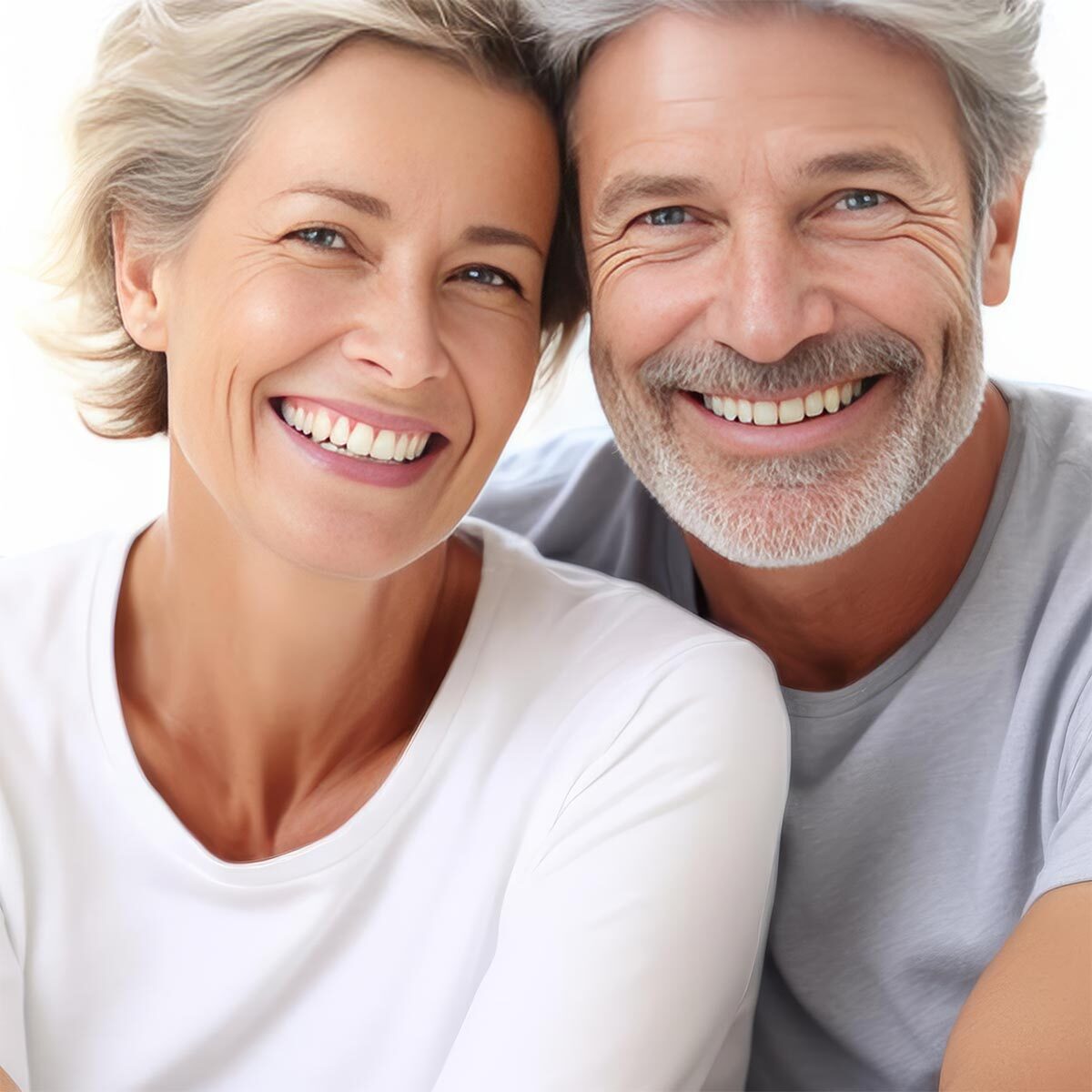 A smiling couple shows off their beautiful white teeth. The adve