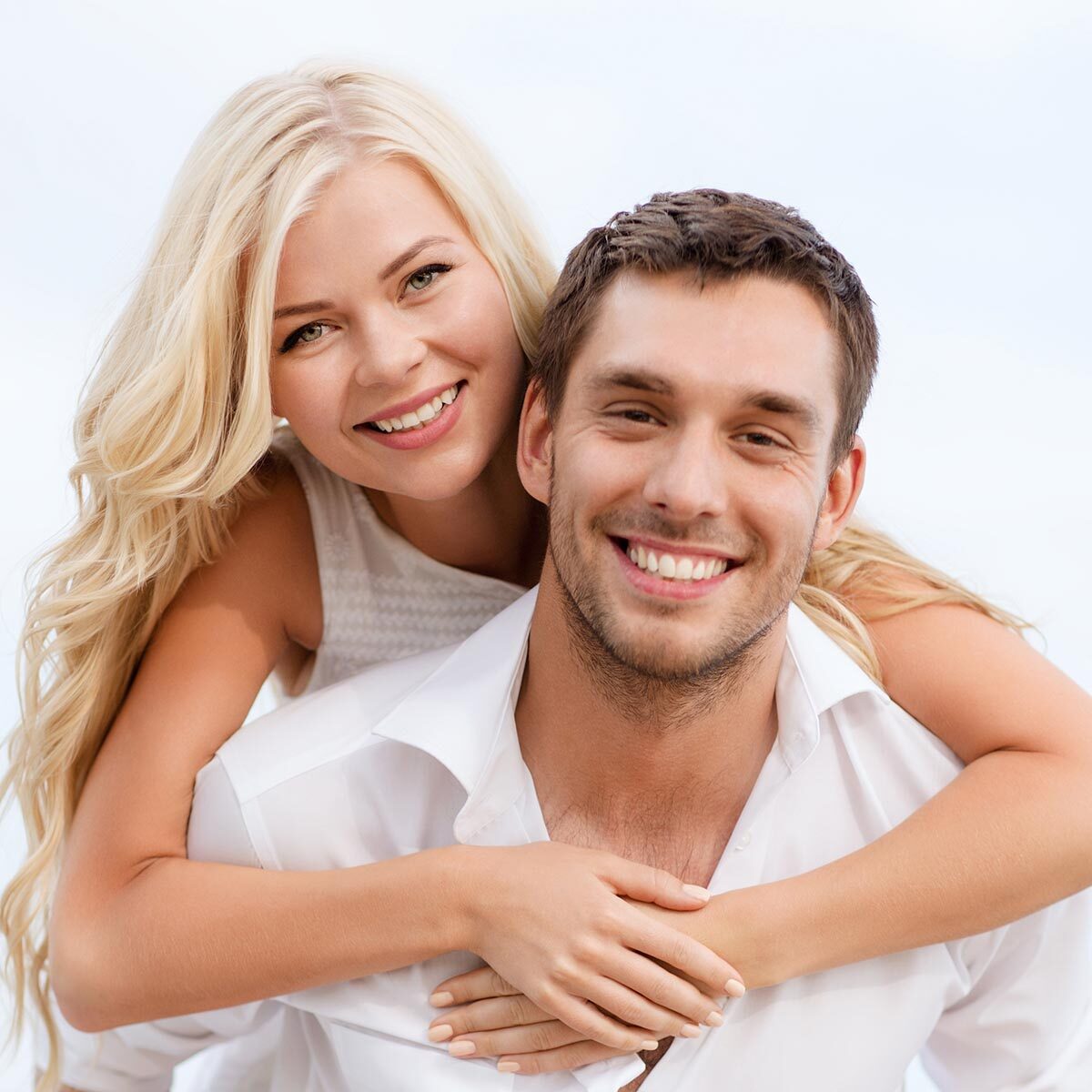 summer holiday, vacation, dating and tourism concept - happy couple having fun on the beach