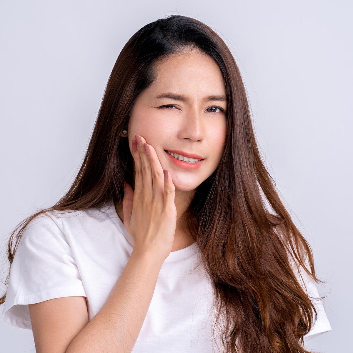 Young asian woman isolated on white background having a strong teeth pain, molar ache.